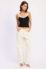 Black Aruna top from Emory Park, stylish sleeveless blouse with a relaxed fit and subtle detailing.