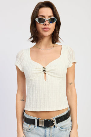 White Clover Top by Emory Park, stylish sleeveless blouse with a relaxed fit, featuring a V-neck and subtle detailing.