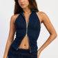 Emory Park Violette vest top in dark denim, sleeveless design, lightweight fabric, styled casually with a V-neck opening.