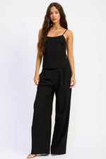 Black Melanie Top by Emory Park, stylish sleeveless blouse with a relaxed fit, displayed on a plain background.