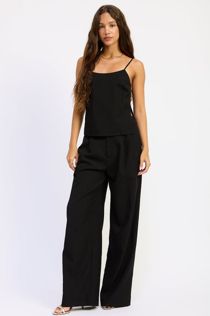 Black Melanie Top by Emory Park, stylish sleeveless blouse with a relaxed fit, displayed on a plain background.