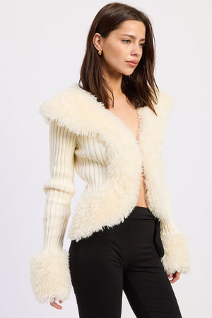 Emory Park Riva cardigan in off-white, soft knit with a relaxed fit, displayed on a hanger against a neutral background.