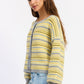 Emory Park Ellie cardigan in lemon grey multi-color, soft knit fabric, long sleeves, and cozy fit, displayed on a hanger.