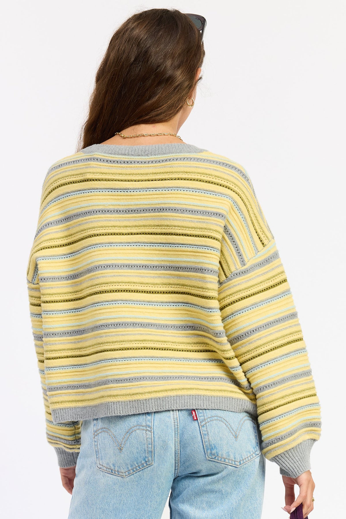 Emory Park Ellie cardigan in lemon gray multi-color, soft knit with a relaxed fit, displayed on a hanger against a neutral background.
