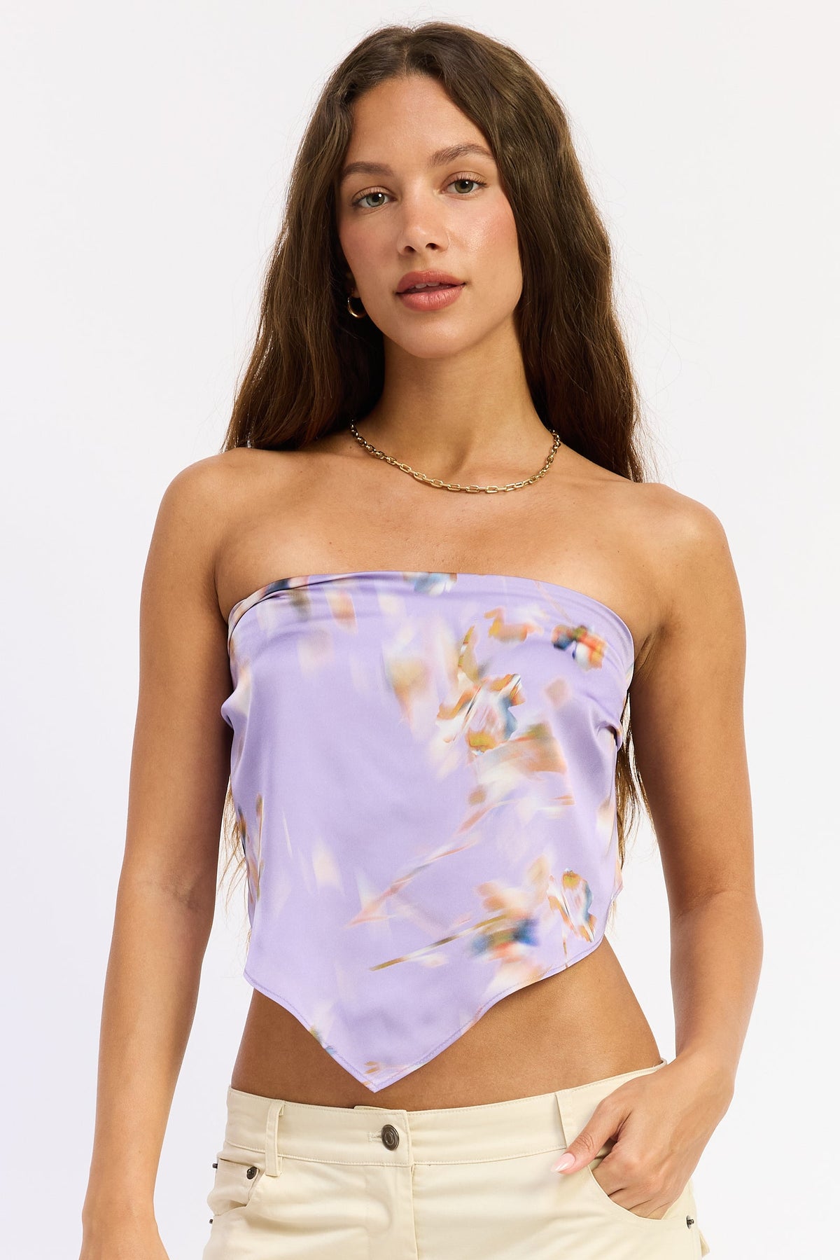 Lavender floral Emory Park Briah Top, a stylish blouse with a relaxed fit and floral pattern, displayed on a hanger.