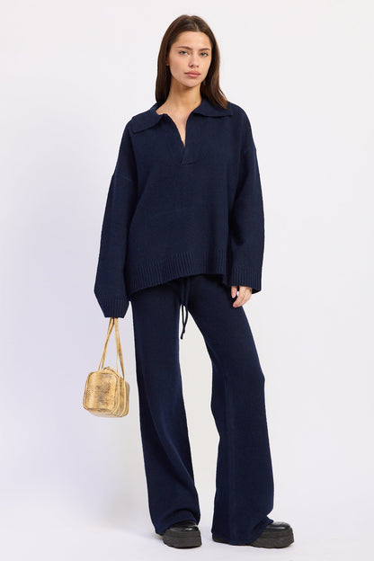 Navy blue Emory Park Aramelle oversized sweater with a relaxed fit and soft knit fabric, displayed on a neutral background.