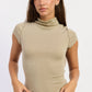 Beige Marnie Top by Emory Park, casual women's blouse with soft fabric and relaxed fit, shown on a hanger.
