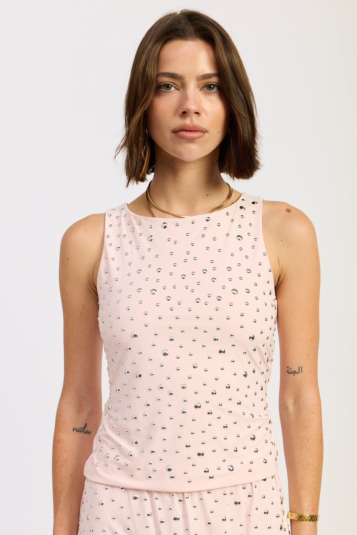 Emory Park Aerith tank top in baby pink, sleeveless casual top with a relaxed fit, displayed on a hanger.