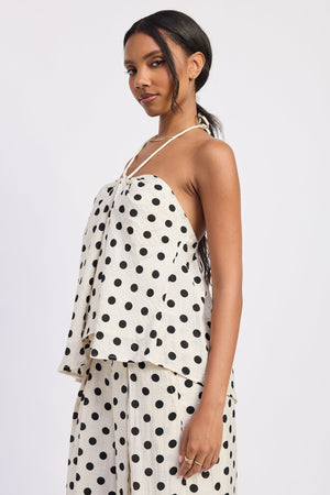 Ivory polka dot Alice halter top by Emory Park, featuring a stylish halter neckline and lightweight fabric.