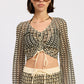 Cream and black Daleyza top by Emory Park, featuring a stylish design, displayed on a neutral background.