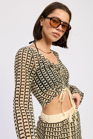Cream and black Daleyza top by Emory Park, stylish short-sleeve blouse with a modern design.