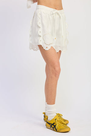 Emory Park Blythe Shorts in off-white, casual denim shorts with a relaxed fit and rolled hems, displayed on a flat surface.