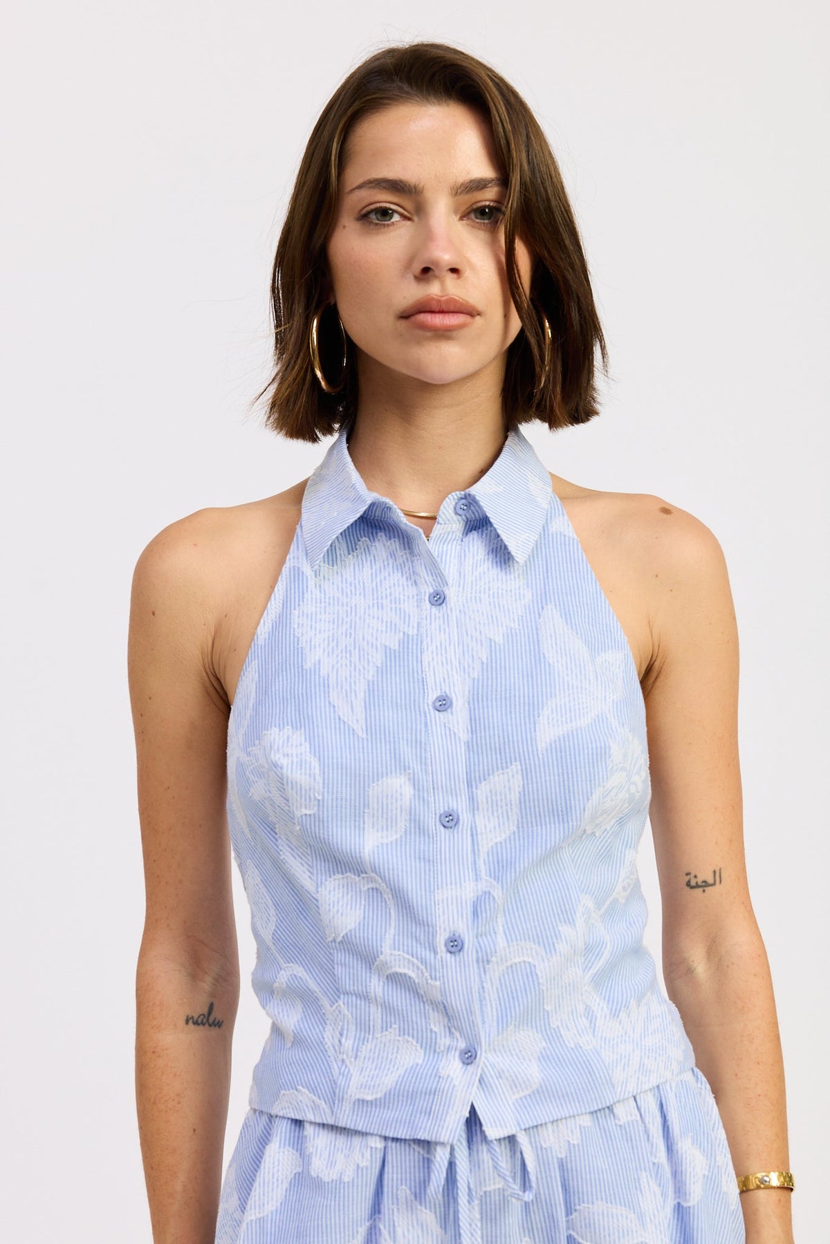 Emory Park Anastasia Top with blue stripe jacquard pattern, featuring a stylish, textured fabric and modern design.