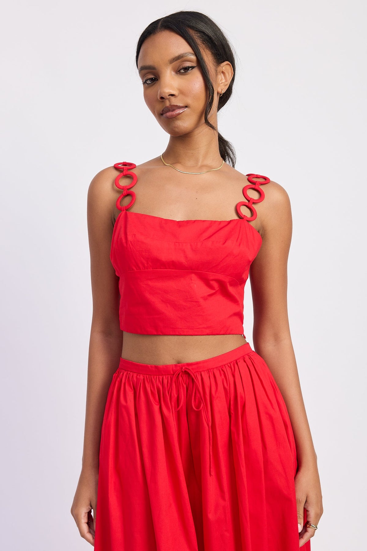 Red Poppy crop top from Emory Park, showcasing a stylish, fitted tops design with short sleeves and a trendy neckline.