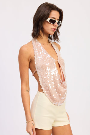 Apricot Tatiana Halter Top by Emory Park, featuring a stylish halter neckline and lightweight fabric, shown on a model.