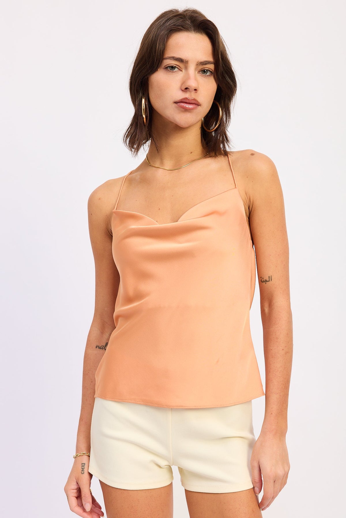 Emory Park Ismene Top in apricot color, showcasing lightweight fabric and stylish design, perfect for casual or dressy occasions.