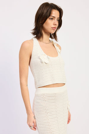 Ivory Isolde halter top by Emory Park, showcasing a stylish sleeveless design with a high neckline and back tie detail.