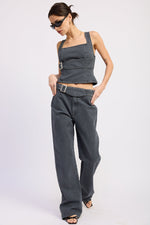 Emory Park Celandine Top in washed denim, casual women's blouse with long sleeves and relaxed fit, displayed on a hanger.