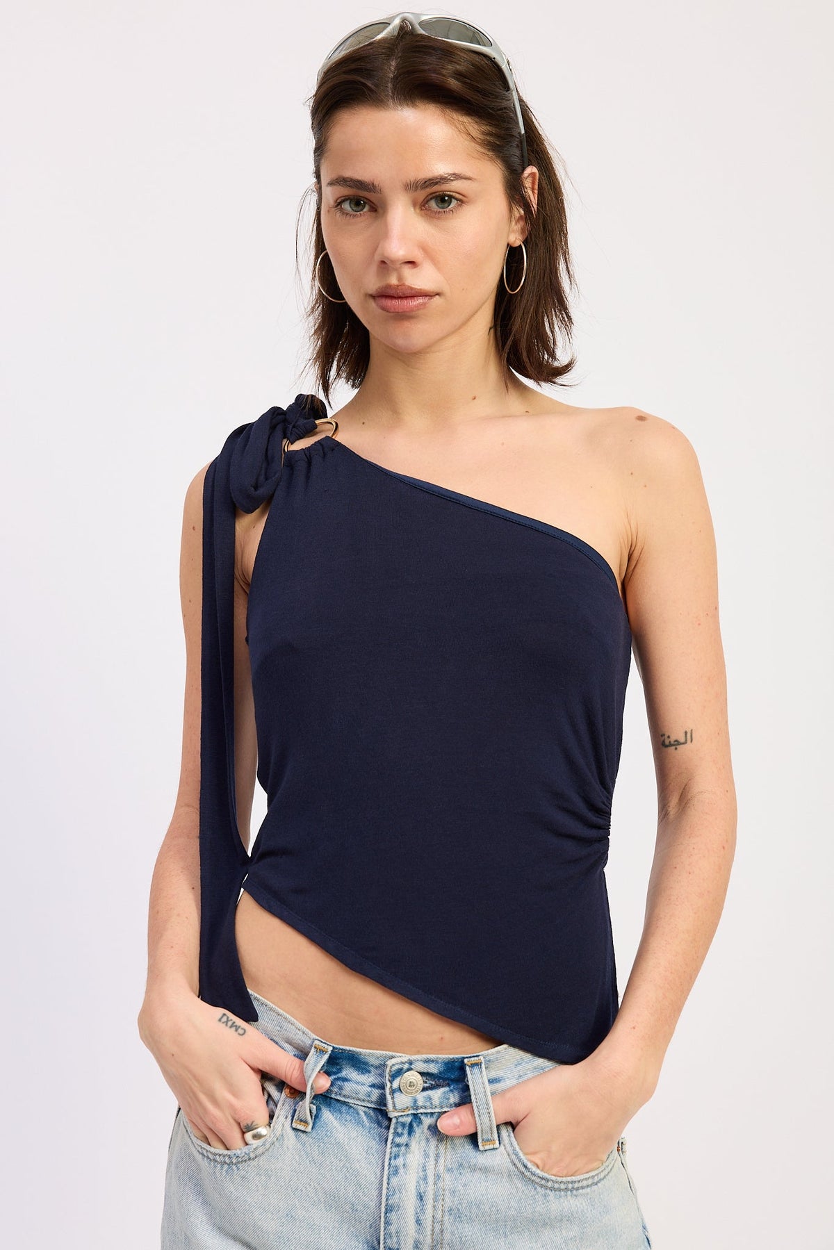 Navy Emory Park Karla Top, a stylish women's blouse with a relaxed fit and lightweight fabric, shown on a hanger.
