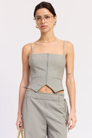 Charcoal Emory Park Natalie vest top displayed on a model, showcasing a sleeveless, fitted design ideal for casual and layered outfits.