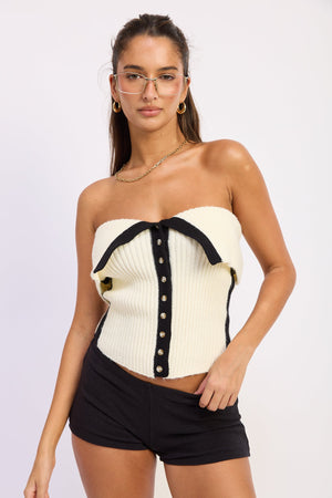 Emory Park Alyssa ivory tube top with fitted design, shown on a hanger against a neutral background.