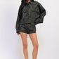 Black Emory Park Halle Suede Shorts with a stylish high-waist design and sleek finish on a model.