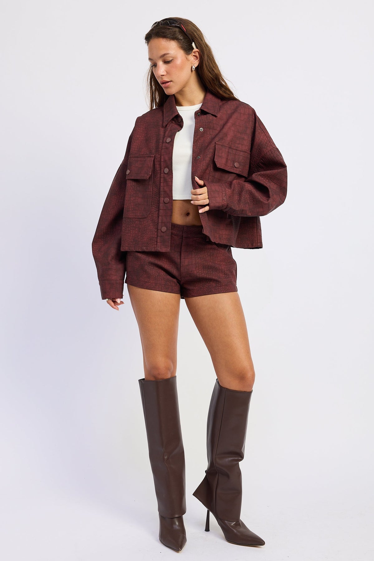 Emory Park Halle suede shorts in burgundy, showcasing their stylish fit and soft suede material on a clean background.