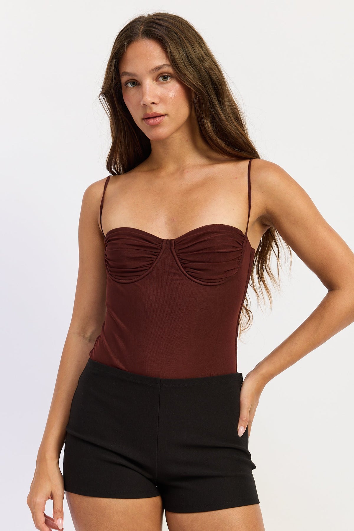 Emory Park Lillian Bodysuit in cayenne red, a stylish women's top with long sleeves and a fitted silhouette.