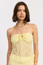 Yellow Zara tube top from Emory Park, showing a close-up of the fitted, strapless sleeveless design on a plain background.