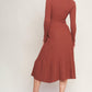 Rust-colored Stolen Kisses Sweater Midi Dress by Flying Tomato, featuring a cozy knit sweater style with a relaxed fit.