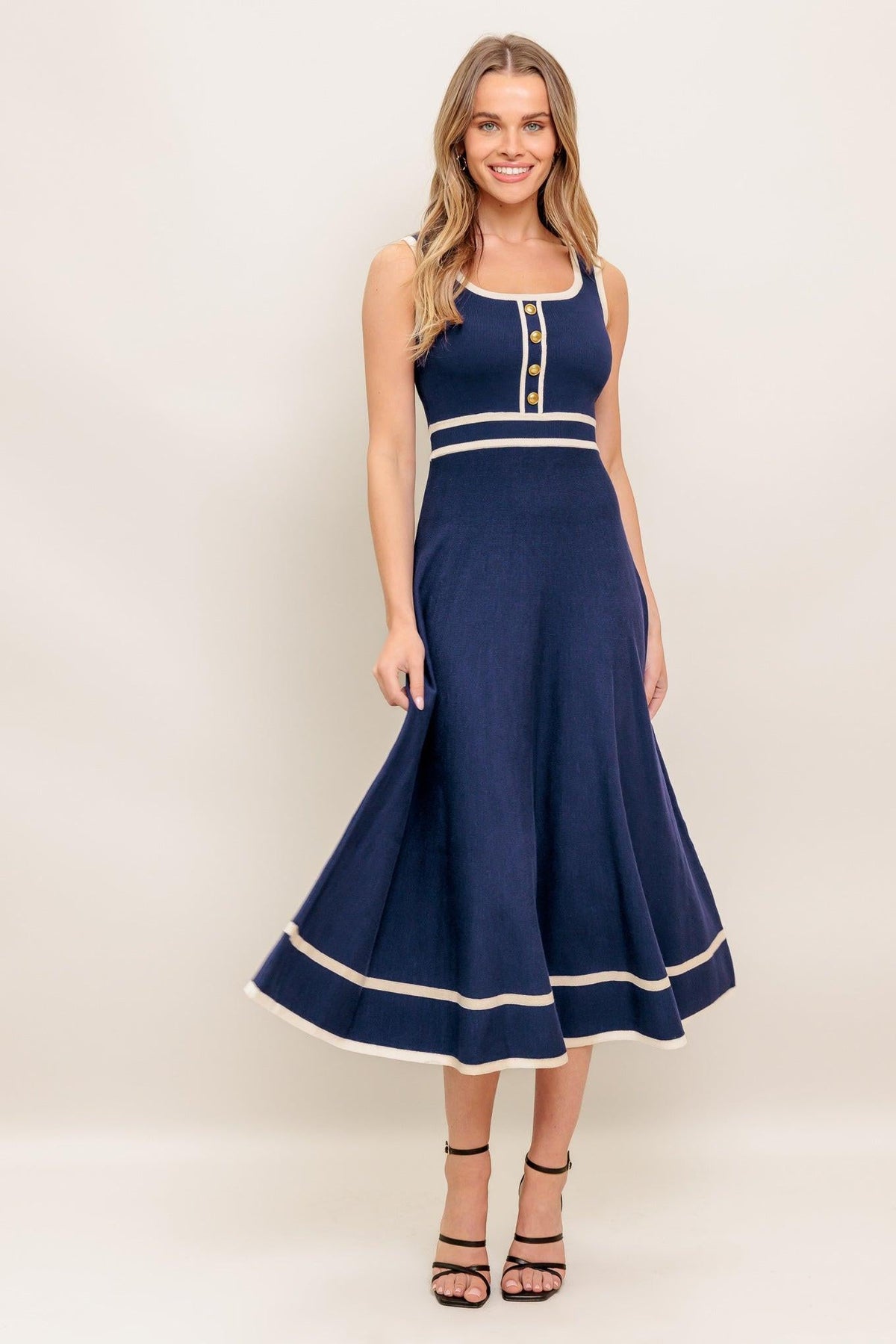 Navy and ivory Dreamy Daisy Knit Midi Dress by Flying Tomato featuring a cozy sweater style with floral pattern detail.