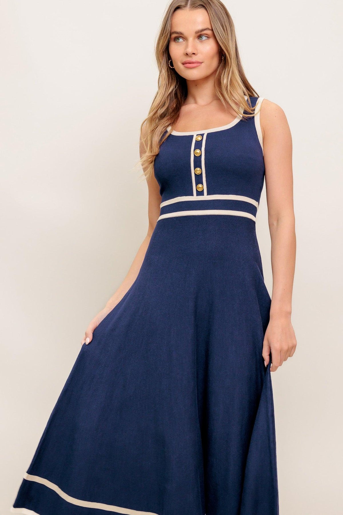 Flying Tomato dreamy daisy knit midi dress in navy and ivory, featuring a cozy sweater style with floral daisy patterns.