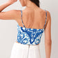 Flying Tomato Coastal Mosaic woven crop top in blue and white with a colorful mosaic pattern, sleeveless design, and relaxed fit.