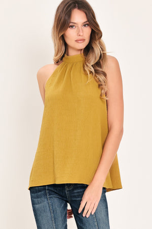 Mustard woven halter top from Flying Tomato's Golden State of Mind collection, showing the detailed front design and fabric texture.