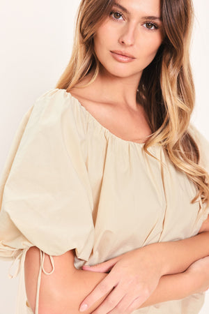 Flying Tomato Natural Charm woven top in stone color, showcasing its textured fabric and casual fit.