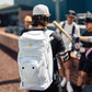 Luccini white wheeled gear bag with durable zippered compartments and retractable handle