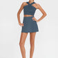 Trophy Yoga criss cross tennis crop top, front view in white athletic fabric