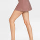 Trophy Yoga built-in pocket tennis skort, made in USA, featuring a white athletic tennis skirt with a built-in pocket and lightweight fabric.