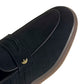Black Adidas men's Handball Spezial loafer with detailed stitching and classic design, displayed on a clean white background.