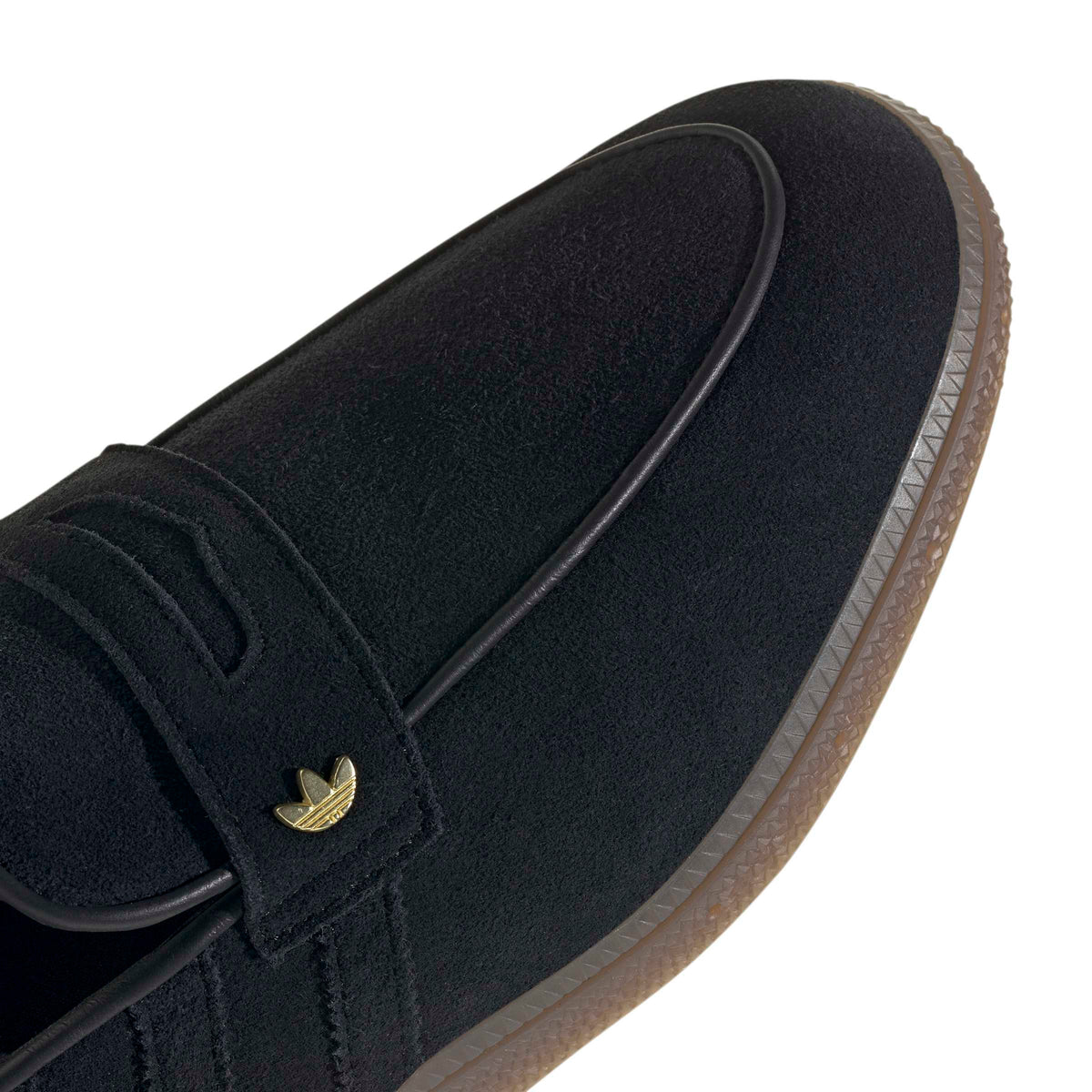 Black Adidas men's Handball Spezial loafer with detailed stitching and classic design, displayed on a clean white background.