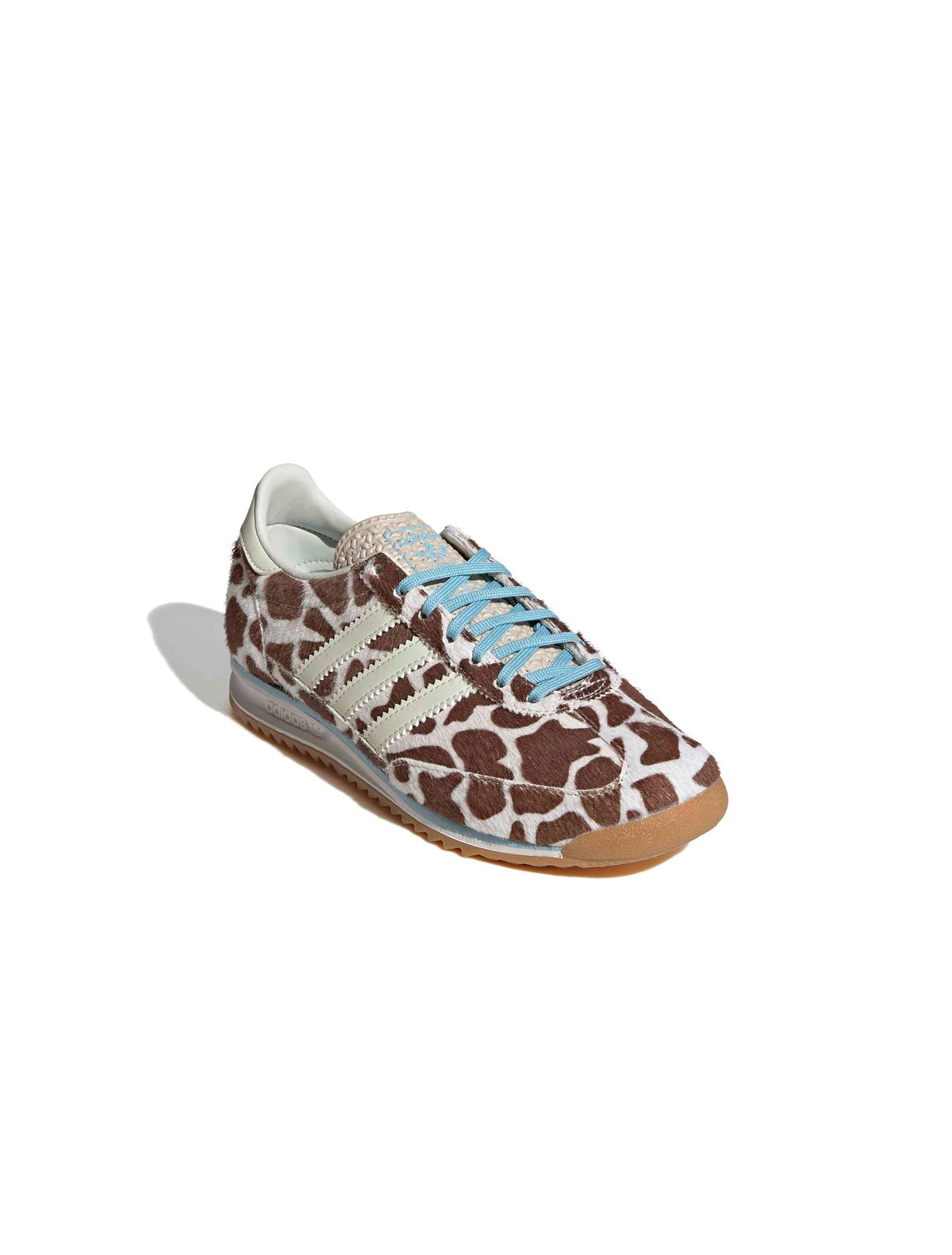 Adidas Womens SL 72 OG cow print sneakers, front and side view, showcasing white footwear with black cow print and classic design.