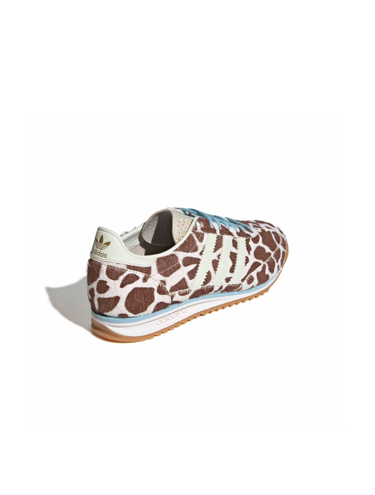 Adidas Womens SL 72 OG cow print sneakers shown from back, lateral, and top view, featuring white footwear with black cow print accents.