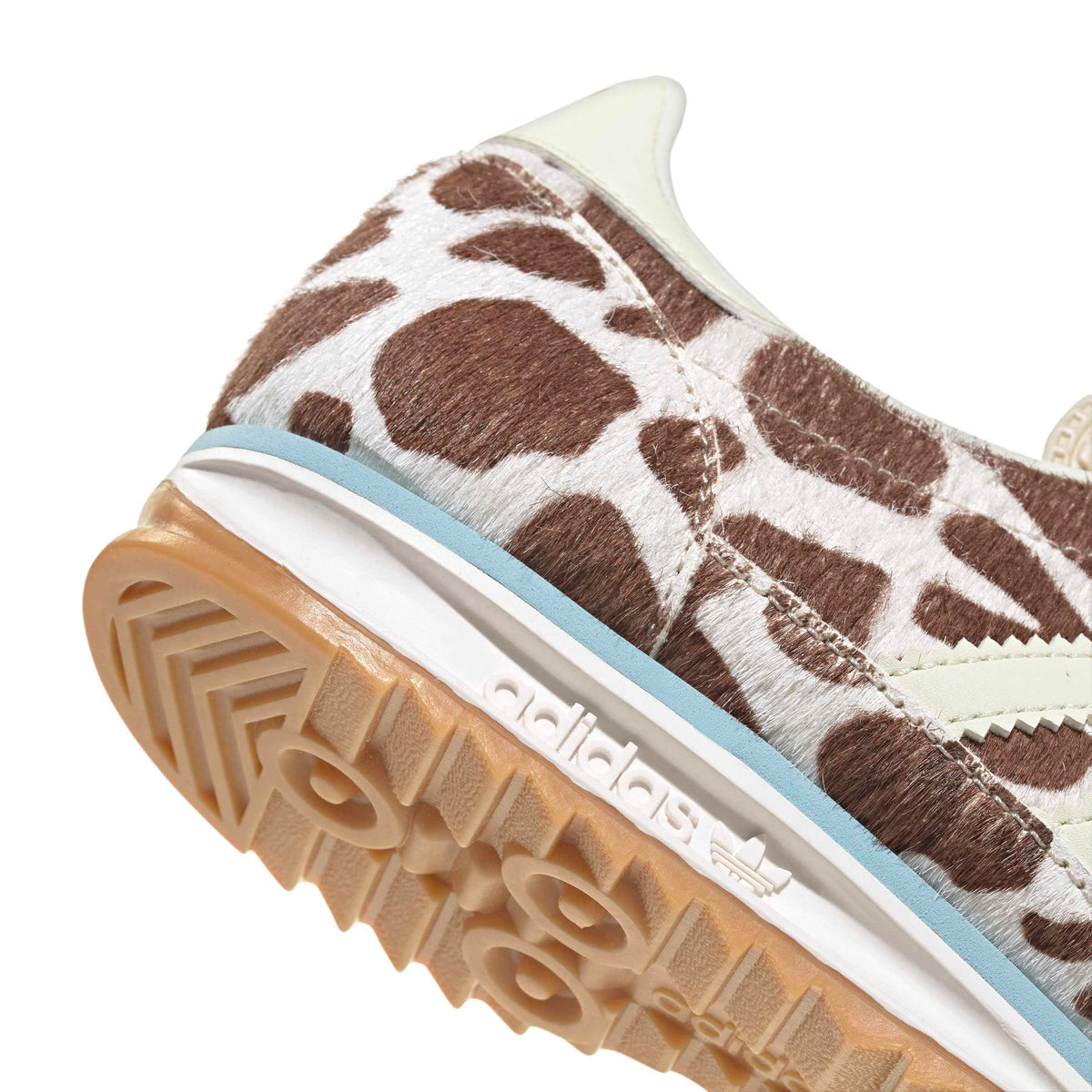 White Adidas Women's SL 72 OG cow print sneakers with retro design, detailed side view showing the classic footwear style.