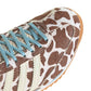 Adidas Womens SL 72 OG cow print sneakers with white leather and black accents, showcasing stylish women's footwear.
