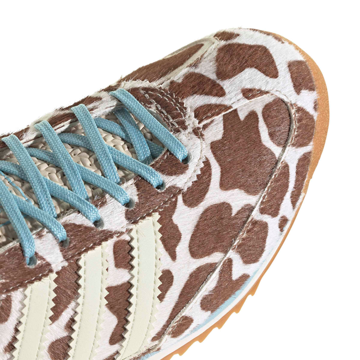 Adidas Womens SL 72 OG cow print sneakers with white leather and black accents, showcasing stylish women's footwear.