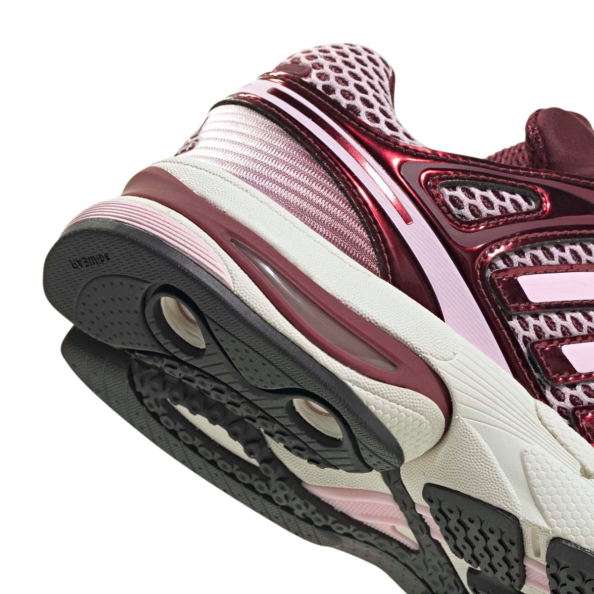 Pink Adidas women's Adistar Control 5 running shoes with white accents, detailed view of the footwear's design and texture.