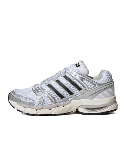 Silver Adidas men's Adistar Control 5 running shoes with side view, showcasing sleek design and sporty style.