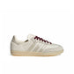 Adidas Women's Samba OG cream and maroon sneakers shown from a side view, featuring classic design and white accents.