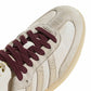Adidas Women's Samba OG cream and maroon sneakers, detailed view showing white leather upper and maroon accents.