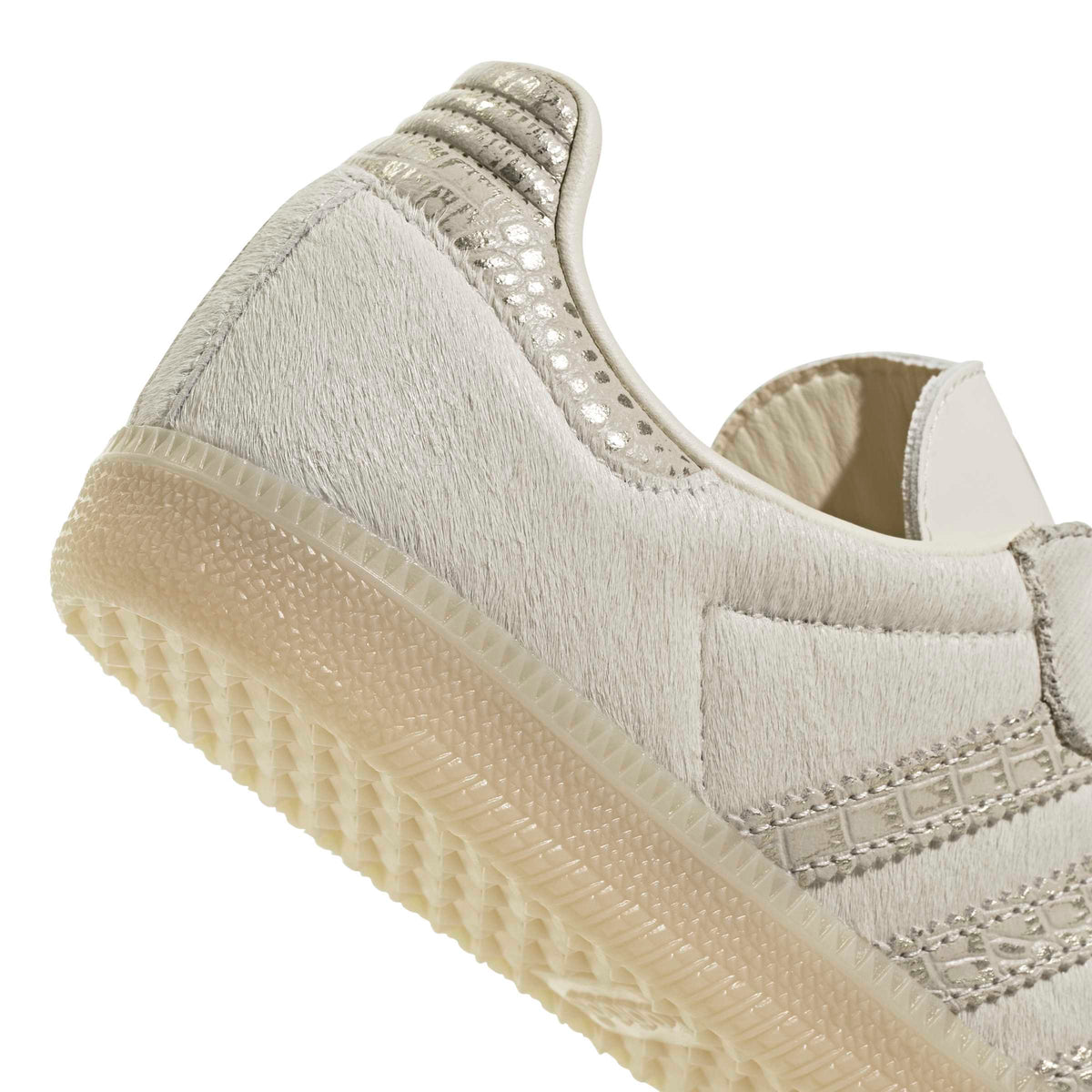 Adidas women's Samba OG cream and maroon sneakers, detailed view of white leather and rubber sole, stylish women's footwear.